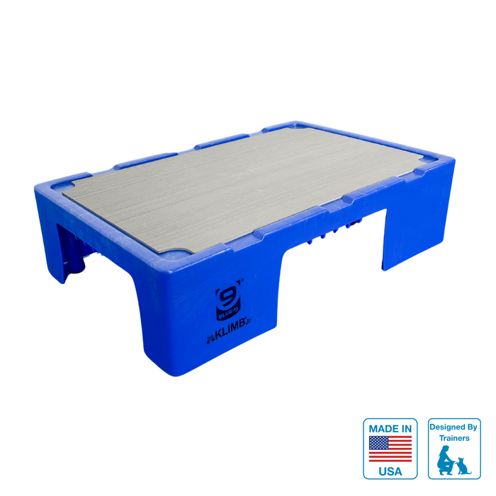 blue KLIMB Jr platform with grey non-slip surface and black logo on a white background. With a made in USA Badge and Designed by Trainers badge