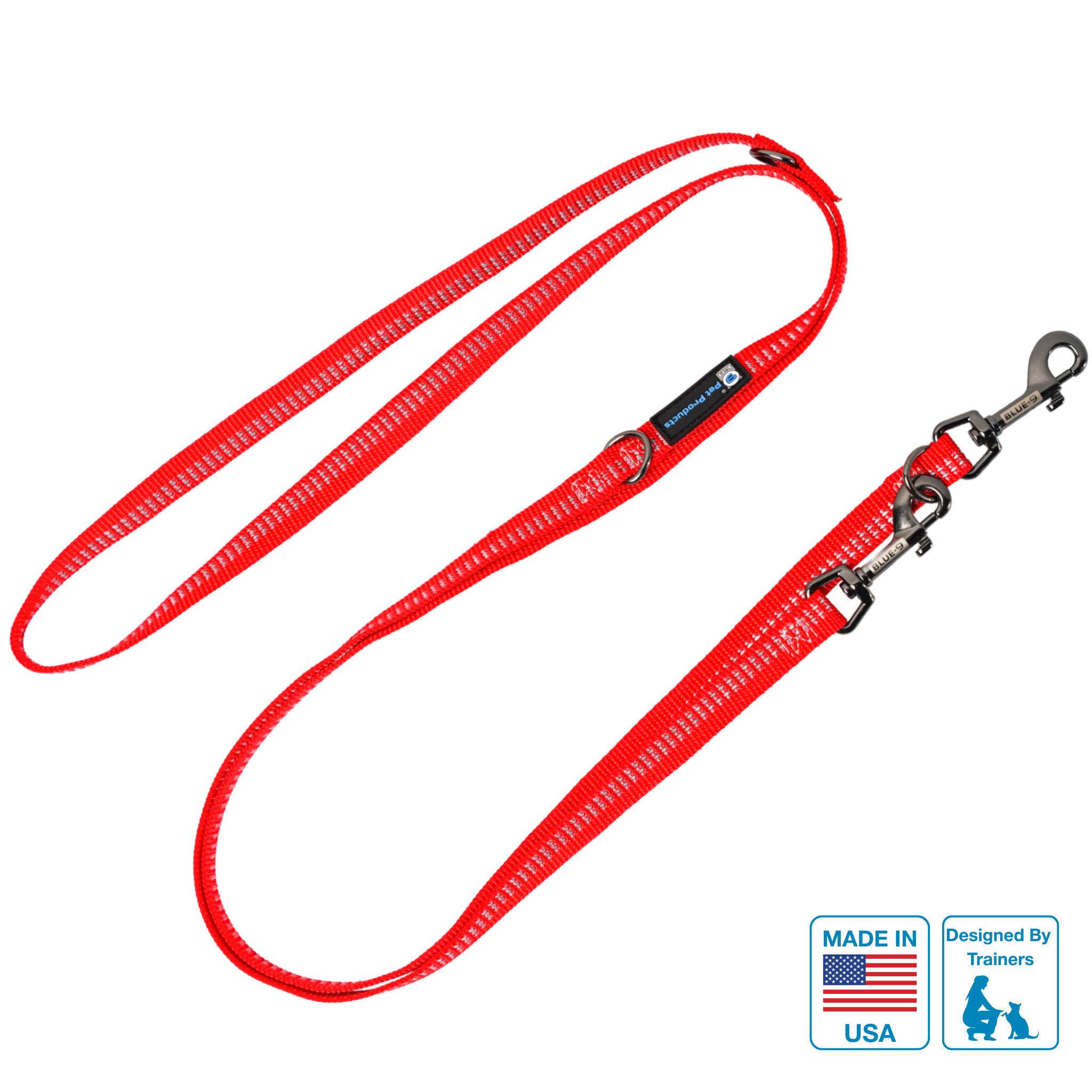 A red reflective multi-function dog leash with a metal clasp and variable length, featuring a 'MADE IN USA' label and a 'designed by' tag.