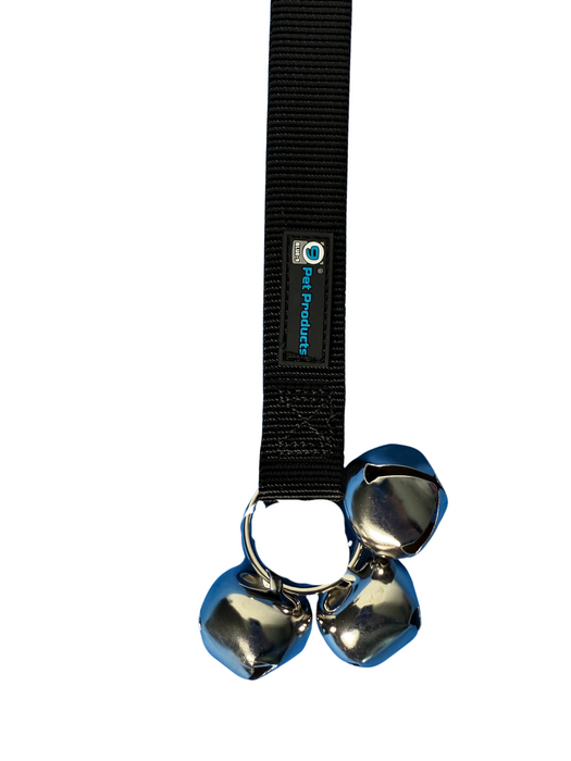 Close up of silver bell hardware attached to black nylon with a Blue-9 Pet Products logo on a white background.