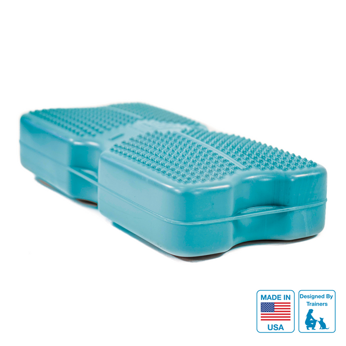 A blue inflatable dog training platform with texture for grip, featuring connection points and a label indicating it is made in the USA.